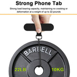 Phone with the tether tab fitted charging both wirelessly on a pad and by cable, showing the 0.019 inch tab does not block charging