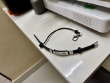 PHLOOP Active Silicone bracelet phone holder showing the tether cord and swivel lobster clasp