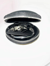 PHLOOP Elite Stainless Steel bracelet phone holder packed inside its round black zip carry case